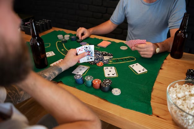 Gaple Online game interface on Android phone showing tile arrangement, player hand, and game board